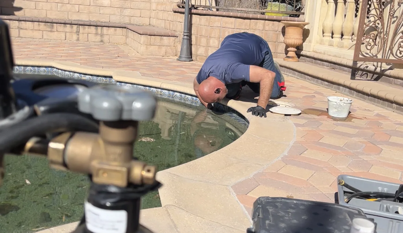 GK Swimming Pools technician performing pool leak detection