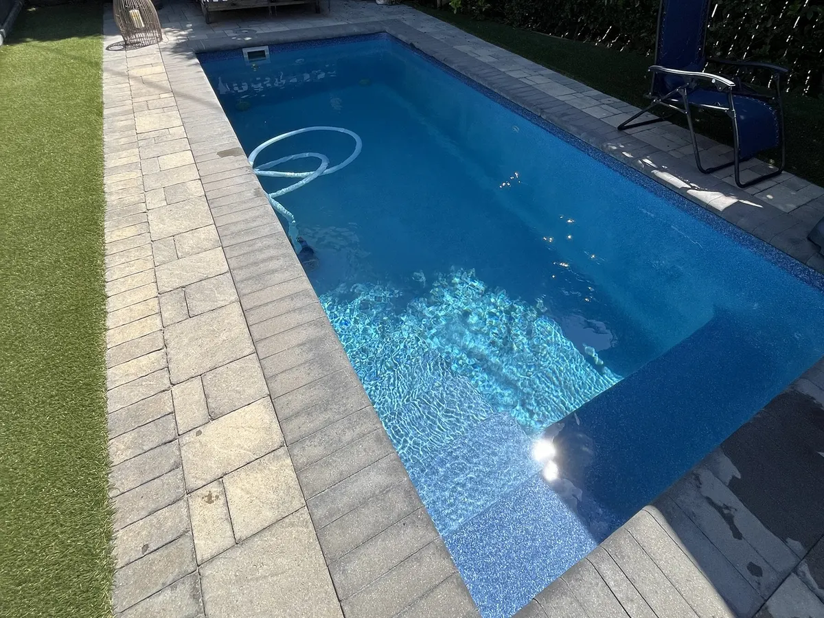 Clean backyard pool on GK Swimming Pools' weekly service route in Sherman Oaks