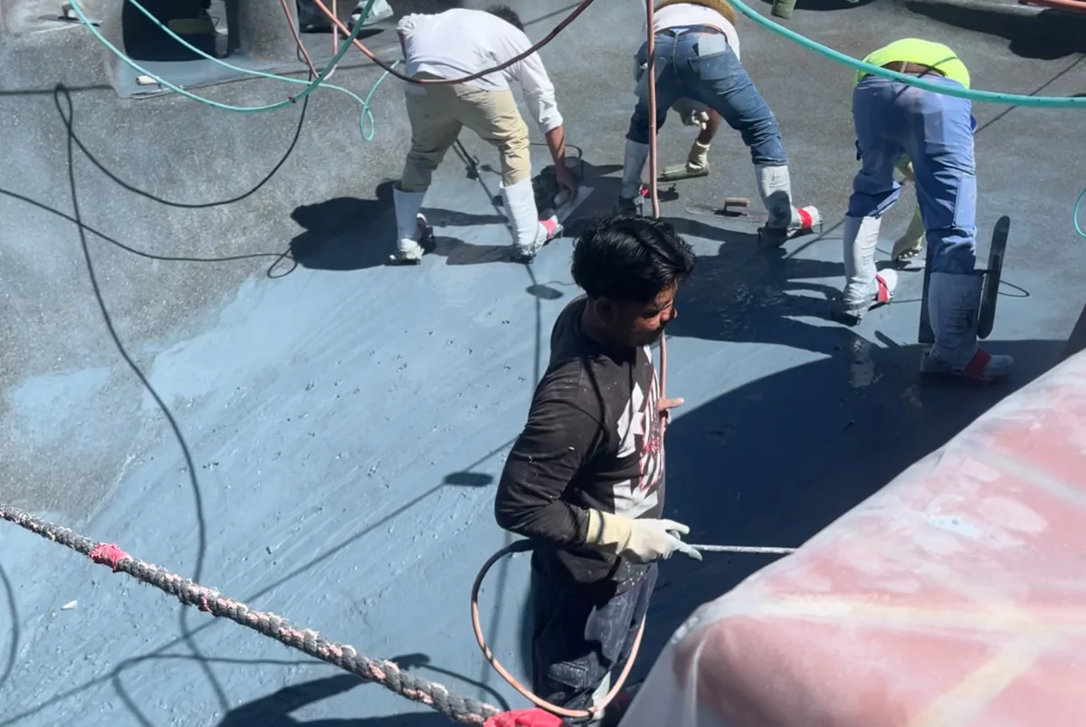 GK pool renovation team working on plaster application