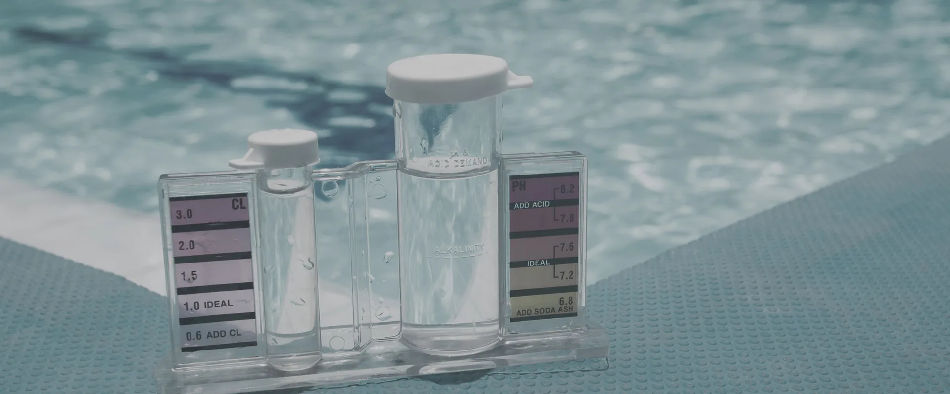 Pool water chemistry testing during a routine maintenance visit