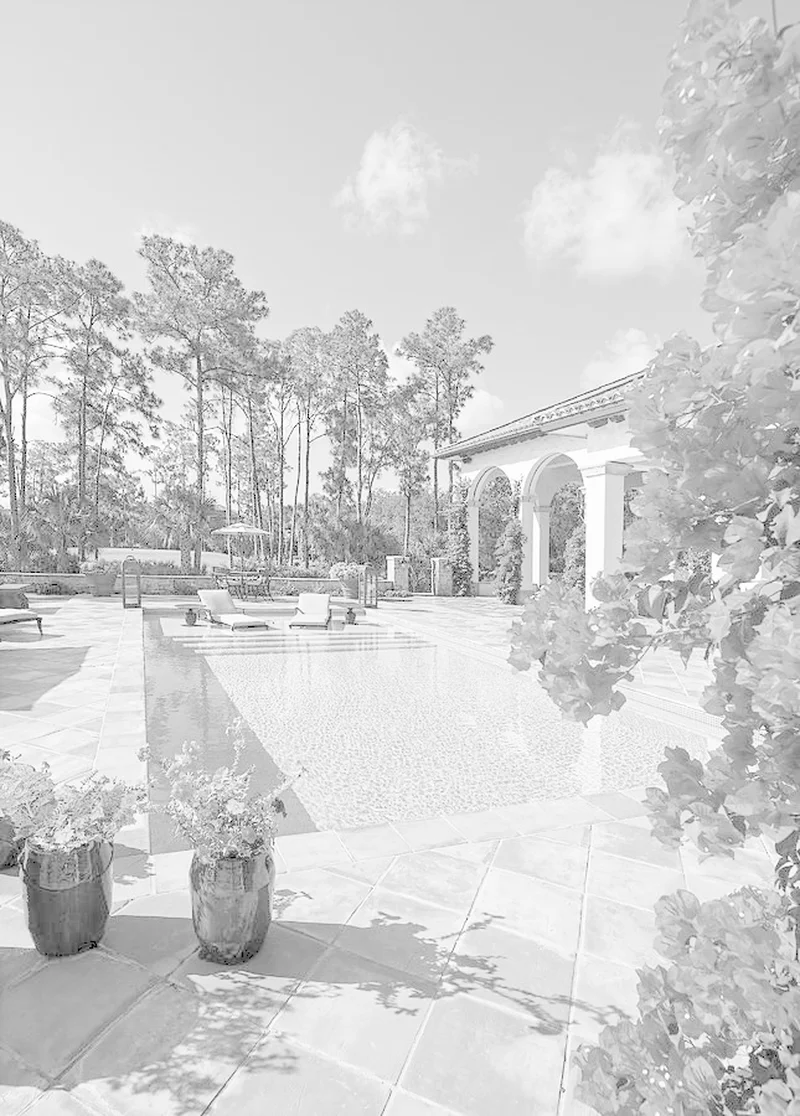 Remodeled backyard pool with terra cotta decking and Mediterranean landscaping