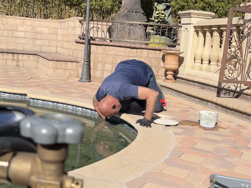 GK Swimming Pools technician performing a pressure test to locate a pool leak